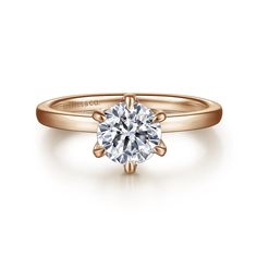 a rose cut diamond engagement ring in 18k yellow gold, with the center stone setting on