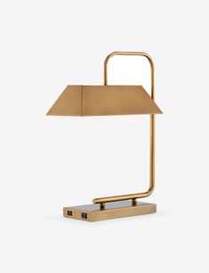 a lamp that is sitting on top of a wooden block with a light in the middle