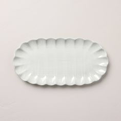 a white oval plate on a gray background