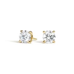 Secret Halo Diamond Stud Ears - 18K Yellow Gold. These classic and eye-catching earrings feature a glittering diamond gallery for a unique flair. Earrings with a total carat weight of 1.00 carat or over will receive a guardian backing and earrings with a total carat weight under 1.00 carat will receive a push backing. The number of diamonds and carat weight varies depending on size of center gem (average 1/15 total carat weight). Round Cut Diamond Earrings, Gold Diamond Earrings Studs, Diamond Stud Earrings, Diamond Stud, 3 Carat, Accessories Jewelry Earrings, Round Earrings, 1 Carat, Round Cut Diamond