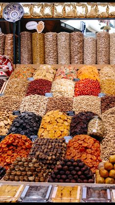 an assortment of nuts and dried fruits for sale