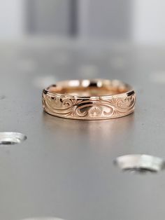 a close up of a wedding ring on a table