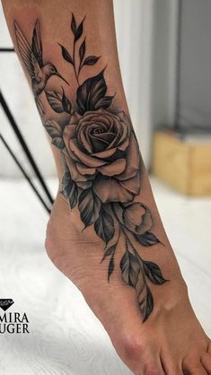 a person with a rose tattoo on their foot is shown in this screenshote