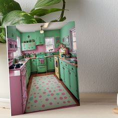 a green and pink kitchen with polka dot rug on the floor art board, next to a potted plant