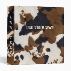 a brown and white cow print binder with the words use your way on it