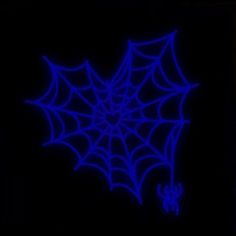 a blue spider web on a black background