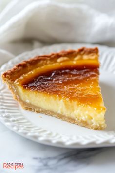 a slice of cheesecake on a white plate with a napkin in the back ground