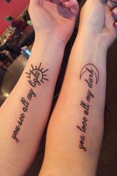 two people with tattoos on their arms holding each other's hands and the words you are