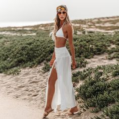 The Black Cover-Up Maxi Skirt is a must-have for effortless beach style. Its flowing silhouette and versatile design make it perfect for layering over your favorite swimsuit. Add a touch of allure to your beach look with our Ruched Waist Split Hem Sarong! The ruched waist and split hem design bring a hint of sophistication to this versatile beach accessory for a chic and stylish layer that effortlessly evokes beach-ready elegance. Product code: CAA07D4A001AA/CAA07D4A001CC Bohemian Stretch Maxi Skirt For Summer, Fitted Maxi Skirt For Beach In Summer, Chic Solid Swim Skirt For Beach, Chic Solid Color Swim Skirt For Beach, Chic Beach Swim Skirt, Summer Vacation Stretch Maxi Skirt, Chic Swim Skirt For Beach, Fitted Summer Maxi Skirt For Beach, Stretch Maxi Skirt For Summer Vacation