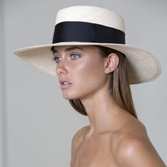 The Ibiza is this season’s playful reimagining of the classic Panama hat, featuring a wider than usual band for a fresh, sophisticated look. HANDMADE IN ECUADOR 100% NATURAL TOQUILLA STRAW BRIM SIZE: 4" SIZE-ADJUSTABLE INNER BAND Classic Spring Hat With Flat Crown, Classic Flat Brim Hats For Spring, Chic Fitted Boater Hat With Flat Crown, Classic White Boater Hat For Spring, Chic Cream Toquilla Straw Boater Hat, Classic Boater Hat With Curved Brim For Spring, Classic White Boater Hat For Vacation, Chic Fedora With Flat Crown For Spring, Chic Fitted Flat Brim Panama Hat