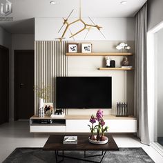 a living room with a tv and some plants on the coffee table in front of it