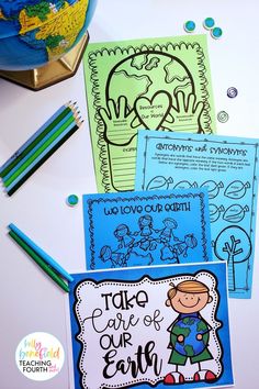 three children's coloring books and pencils on a table