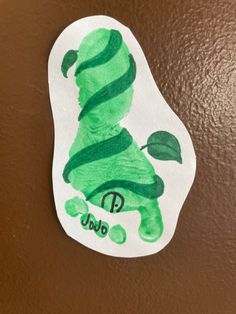 a child's drawing of a green leaf with the letter j is for jabo