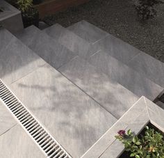 an overhead view of a concrete building with plants