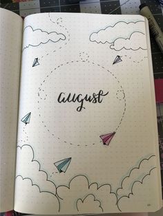 an open notebook with the words august written on it