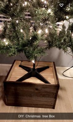 a small christmas tree in a wooden box with lights on it's sides and the words diy christmas tree box underneath