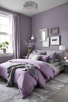 a bedroom with purple walls and grey bedding