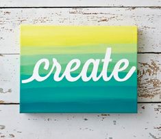 a painting with the word create painted in white letters on a blue and yellow background