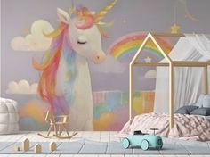 a child's bedroom decorated in pastel colors with a rainbow unicorn wall mural