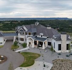 an aerial view of a large home in the country