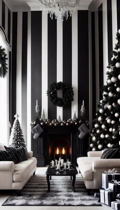 a living room decorated for christmas with black and white striped walls