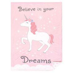 a pink towel with a unicorn on it and the words believe in your dreams written below