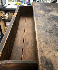 an old wooden box is sitting on the table