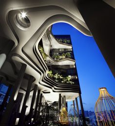 an architecturally designed building in the city at night