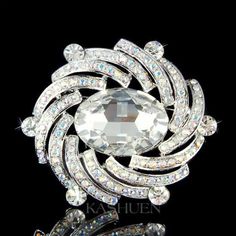 "PERFECT GIFT /WEDDING GIFT FOR BRIDE / BRIDESMAID / LADY! This stunning Sideways Oval shaped brooch is completely covered with SWAROVSKI crystals. Super sparkling! This sparkling pin measures 2 1/2\" wide X 2 3/16\" high (63mm X 55mm). Crystal Color: Aurora Borealis, Crystal Clear Great piece for your collection! Prices are in US$. For shipping policies and other important information, click on \"profile\" on the right. See an item that you like but has already been sold? Contact me to see if I White Oval Brooch For Anniversary, White Crystal Brooch For Formal Occasions, Formal White Crystal Brooches, Elegant Oval Wedding Brooches, White Crystal Brooch For Anniversary, White Crystal Brooches For Wedding, Silver Oval Brooches For Wedding, White Crystal Wedding Brooches, Silver Oval Wedding Brooches