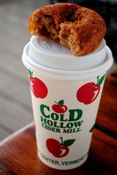 a close up of a doughnut on top of a cup