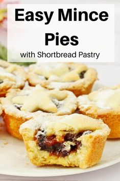 easy mince pies with shortbread pastry on a white plate and flowers in the background