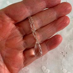 Rock Crystal Quartz Teardrop Necklace Sterling, Crystal Clear Healing Necklace, Faceted Stone Necklace    This crystal clear quartz necklace is about 17 inches long and dangles from a sterling silver chain and spring right clasp.  Its natural stone is a faceted teardrop of rock crystal quartz.     Create a matching set by checking out the other crystal clear options in my shop:  https://www.etsy.com/shop/JulieEllisDesigns?ref=seller-platform-mcnav&search_query=crystal+clear Your jewelry will be Clear Necklace, Clear Quartz Necklace, Healing Necklace, Teardrop Necklace, Crystal Quartz, Quartz Necklace, Rock Crystal, Sterling Silver Chain, Clear Quartz