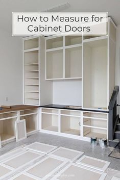 an empty room with white cabinets and flooring