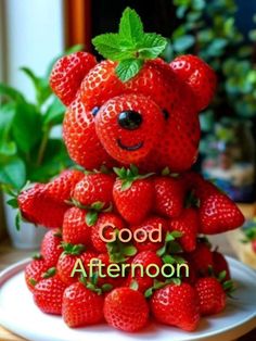 a teddy bear made out of strawberries with the words good afternoon written on it