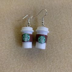 - Fun Earrings With Mini Starbucks To-Go Cups! - Handmade (By Myself) And Packaged With An Earring Card, Wrapped In A Cellophane Bagperfect For Gifts! - On Silver Fishhook Earring Hooks **Add 3 Jewelry Items Marked “3 For $20” To Your Bundle And I Will Send You An Offer For $20** Tags: Coffee, Espresso, Frappe, Latte, Starbucks Check Out My Closet For More Handmade Jewelry, Including Other Colors And Styles Of Starbucks Cups, Popular Characters, And Trendy Earrings To Go Cup, Popular Characters, Earring Card, Coffee Espresso, Fish Hook Earrings, Earring Cards, Trendy Earrings, Starbucks Cups, Earring Hooks