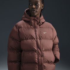 Up your outerwear game in this insulated puffer jacket. A loose fit makes it ideal for layering while the Nike Therma-FIT technology helps manage your body’s natural heat to help keep you warm in cold-weather conditions. A water-repellent finish, bungees at the hem and a hood work together to help shield you from wind and rain. Nike Hooded Puffer Jacket For Winter Sports, Sporty Puffer Jacket With Padded Collar For Outdoor Activities, Winter Sports Long Sleeve Puffer Jacket, Nike Hooded Puffer Jacket For Sports, Sportswear Puffer Jacket For Outdoor Activities, Sporty Puffer Jacket With Adjustable Hood For Sports, Sporty Puffer Parka, Sporty Puffer Jacket With Drawstring Hood For Cold Weather, Sporty Long Sleeve Puffer Parka