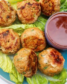 crab cakes with lettuce and ketchup on a plate