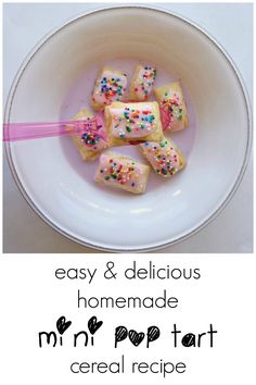 a white bowl filled with cake and sprinkles on top of a table