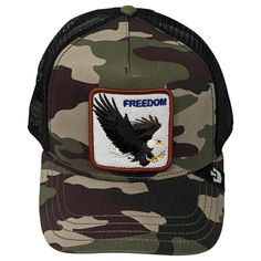 The Goorin Freedom Eagle baseball cap is part of Goorin's Animal Farm collection. The front panel is constructed of polyester/cotton canvas and features a patch embroidered with a flying bald eagle and the word 'freedom.' Its curved bill is made of the same camouflage material. Inside, the cap is unlined and it has a soft cotton-twill sweatband for comfort. The rear of the cap is a trucker-style mesh, complete with an adjustable snapback enclosure to ensure a great fit. Trucker Baseball Cap With Patches For Outdoor, Trucker Style Baseball Cap With Patches For Outdoor, Outdoor Trucker Hat With Patches, Military Snapback Baseball Cap With Logo Patch, Outdoor Patches Baseball Cap, Outdoor Trucker Hat With Logo Patch For Baseball Season, Trucker Baseball Cap With Letter Patch For Outdoor, Outdoor Trucker Baseball Cap With Letter Patch, Trucker Style Baseball Cap With Patches