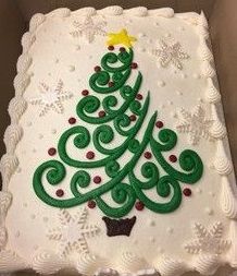 a decorated cake in the shape of a christmas tree