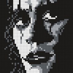 a pixellated image of the joker in black and white, with an evil look on his face