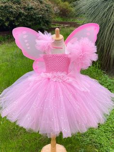 Welcome to Baby/Infants Clothing  by Funkids&Us Boutique ` This tutu  dress is super cute and adorable it is perfect for  birthdays, photographs, Halloween party  or everyday dress up.dress up!  This tutu dress is made premium tulle of pink and glitter pink tulle   with pink crochet top. I make sure that my Tutu dress is very full and fluffy!! ..  the crochet bodice top is design with fabric flowers. I also made a matching headband and fairy wand  Kids really love this costume and you bring smil Fairy Dress Kids, Pink Fairy Dress, Baby Tutu Outfits, Tutu Top, Pink Tutu Dress, Handmade Tutu, Girls Tulle Dress, Pink Fairy, Glitter Flowers