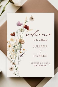 a wedding card with flowers on it