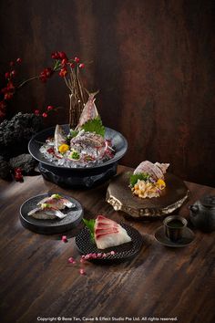 a table topped with plates and bowls filled with different types of food on top of it