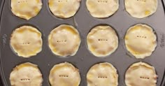 an uncooked pan filled with different types of pastries on top of a stove