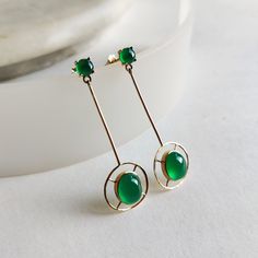 These stunning earrings are set in 14K Solid Yellow Gold with Natural Green Onyx with utmost precision. It is an unique gemstone earring pair for nearly every occasion and is completely hassle-free jewelry. 🔷ABOUT GEMSTONE: Green onyx is often associated with emotional healing and balance. In some holistic healing practices, green onyx is used to support physical health. It is believed to help with ailments related to the heart, kidneys, and the nervous system. It is believed to attract positiv Classic Round Linear Earrings For Gifts, Classic Round Linear Earrings Gift, Elegant Green 14k Gold Earrings, Modern Earrings With May Birthstone Gemstone, Modern Green 14k Gold Earrings, 14k Gold Green Pierced Earrings, 14k Gold Round Earrings For Evening, Elegant Green Linear Earrings As Gift, Classic Round Linear Earrings