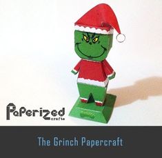 the grinch papercraft is wearing a santa hat