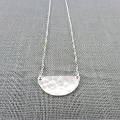 "Silver Half Moon Necklace | Hammered Half Circle Necklace | Sterling Silver Festoon Pendant | Handcrafted Geometric 925 Jewelry My silver half moon necklace features a hand hammered half circle festoon style pendant on a silver cable chain. All materials are .925 US-procured sterling silver. The hammered half circle is attached directly to the chain and is measured as part of the total length of the chain. I have 3 options for lengths available to select at checkout. The model is wearing an 18\ Minimalist Semi-circle Jewelry As Gift, Hammered Half Moon Jewelry As A Gift, Adjustable Silver Half Moon Necklace, Hammered Half Moon Jewelry For Gifts, Nickel Free Half Moon Silver Necklace, Hammered Half Moon Jewelry For Gift, Adjustable Half Moon Silver Necklace, Nickel-free Silver Half Moon Necklace, Nickel-free Silver Half-moon Necklace