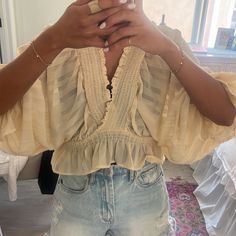 Flowy, V Neck, Cream Blouse, Bell Sleeves, Tie In The Back, Never Worn! Beachy V-neck Top For Day Out, Chic V-neck Blouse For Vacation, Summer V-neck Peasant Top With Ruffles, Summer Peasant Top With Ruffles And V-neck, V-neck Peasant Top With Ruffles For Summer, Chic Blouse For Beach Season Brunch, Feminine Tops For Beach Day Out, Summer Blouse For Day Out, Summer Bohemian Cropped Peasant Top