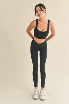 Experience comfort and optimum performance with this Black Under Control Bra & Legging Set. This set features a supportive and compressive fit with bold strappy back detail and high waisted leggings with convenient side pockets. Crafted with durable materials, this set is perfect for a range of workouts. Fabric & fit: 75% Nylon, 25% Spandex Model is wearing size Small. Medium Support Gym Leggings With Contoured Waistband, Gym Leggings With Contoured Waistband And Medium Support, Sports Leggings With Contoured Waistband And Medium Support, Sporty Leggings With Contoured Waistband And Medium Support, Medium Support Leggings With Contoured Waistband For Workout, Compressive Contoured Waistband Sportswear, Athleisure Leggings With Contoured Waistband, Medium Support, Compressive Sportswear Activewear With Contoured Waistband, Athleisure Activewear With Contoured Waistband